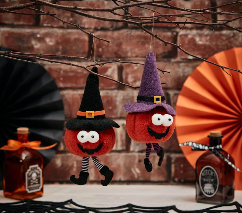 Quirky Halloween novelty pumpkin hangers with googly eyes and witch hats, perfect for adding charm to your spooky décor.