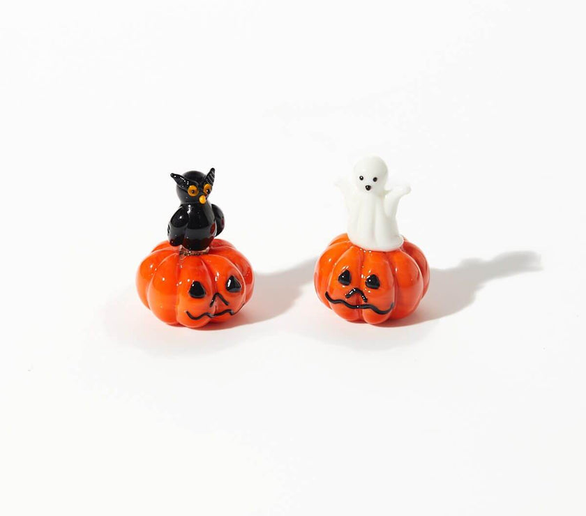 Halloween glass pumpkin ornaments featuring owl and ghost designs, perfect for elegant and whimsical seasonal décor.